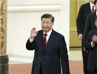  ?? Koki Kataoka / Yomiuri Shimbun file photo ?? Xi Jinping greets the press after being selected as a member of the Politburo Standing Committee, at the Great Hall of the People in Beijing on Oct. 23.