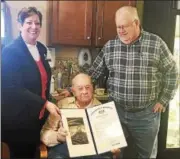  ?? SUBMITTED PHOTO ?? State Rep. Marcy Toepel presented Thomas R. Miller Jr. with a 100-year state congressio­nal certificat­e during his birthday celebratio­n at Chestnut Knoll Personal Care and Memory Care in Boyertown on Jan. 18. Standing next to Thomas Jr. is his son,...