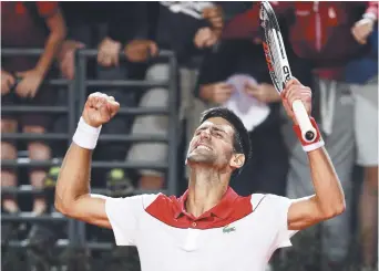  ??  ?? Novak Djokovic festoie après sa victoire face à Kei Nishikori, vendredi, à Rome. - Associated Press: Andrew Medichini