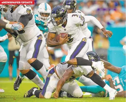  ?? MARK BROWN/GETTY IMAGES ?? Ravens quarterbac­k Robert Griffin III runs with the ball in the first quarter during a preseason game against the Dolphins at Hard Rock Stadium on Saturday night. Griffin, who started the game, rushed five times for 41 yards.