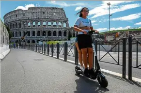  ?? — AFP ?? With the easing of lockdowns and good summer weather, self-service shared electric scooters have invaded the streets of rome, Italy in recent days.