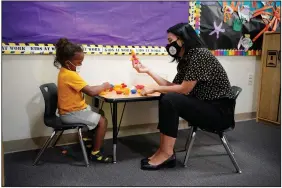  ?? (AP/John Locher) ?? 2021 National Teacher of the Year Juliana Urtubey interacts Wednesday with Kamari Wolfe in a class at Kermit R. Booker Sr. Elementary School in Las Vegas.