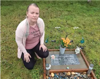  ??  ?? Crystal Ellis at the grave of her son Camden, who died from an accident involving a defective Ikea dresser.