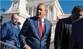  ?? Jabin Botsford/The Washington Post ?? Texas Attorney General Ken Paxton, right, walks outside the Supreme Court in 2021 as arguments begin in Washington on a Texas abortion law.