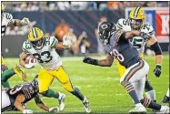  ?? PRESS] [CHARLES REX ARBOGAST/ THE ASSOCIATED ?? Green Bay Packers' Aaron Jones runs during the second half of an NFL football game against the Chicago Bears on Thursday in Chicago.
