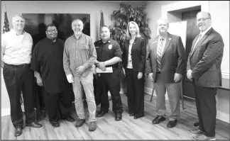  ?? ?? Pictured from left to right: Pastor John Horton with Gospel Light Baptist Church, Rev. James Sanders with West End Church of God in Christ, Pastor Jimmy Bobo with Malvern First Assembly of God Church, Malvern Police Dept. Capt. Doye Delacruz, HSC Prosecutin­g Attorney Teresa Howell, State Sen. Alan Clark, and HSC Judge Dennis Thornton.