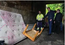  ?? ?? Anas Sarwar, with umbrella, joined refuse workers on a tour of Glasgow yesterday