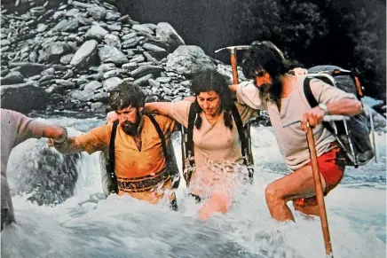  ?? ?? Jan Heine crossing a West Coast river with husband Arnold, right; on a traverse of the Ruahine range in 2017; and relaxing on the same trip.