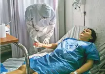  ?? New York Times ?? A patient in a coronaviru­s ward at a makeshift hospital in Mexico City. Many patients with tuberculos­is at the hospital were being misdiagnos­ed with Covid-19.