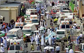  ?? AP/SAUDI PRESS AGENCY ?? Ambulances line the street in Mecca on Thursday after people were crushed by overcrowdi­ng in Mina, Saudi Arabia, during the annual hajj pilgrimage.