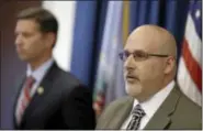  ?? AP Photos ?? Ashland City police Lt. Joel Icenhour answers questions during a news-conference Tuesday in Cleveland. Authoritie­s in Ohio have arrested three people on charges of enslaving a mentally disabled young mother and her daughter over a two-year period.