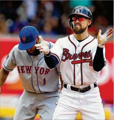  ?? CURTIS COMPTON / CCOMPTON@AJC.COM ?? The Braves’ Ender Inciarte reacts to getting a double against the Mets during their game on Wednesday in Atlanta. Inciarte has provided his usual strong defense and has 20 stolen bases.