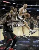  ?? ERIC GAY — THE ASSOCIATED PRESS ?? San Antonio’s’ Manu Ginobili (20) comes down with a rebound in front of Houston’s Patrick Beverley (2) during the first half Game 5 Tuesday in San Antonio. in