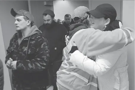  ?? DAN JANISSE ?? Jamieson Laboratori­es workers leave a ratificati­on vote on Tuesday at the union hall on Somme Avenue. They workers voted 79 per cent in favour of the new contract deal.