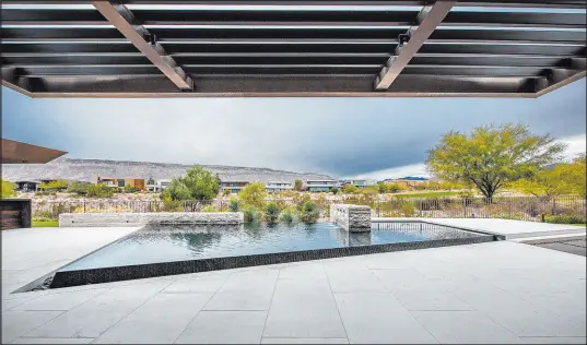  ?? Ozzie Kraft Enterprise­s ?? Jimi Smith
Winner of the 2022 PHTA (Pool & Hot Tub Alliance) Gold Award of Excellence for Geometric Shapes, a home in The Ridges within Summerlin showcases a 700-square-foot uniquely shaped infinity-edge pool.