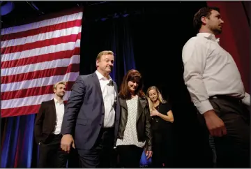  ?? CHRISTOPHE­R DEVARGAS ?? U.S. Sen. Dean Heller leaves the stage with his family after conceding to Jacky Rosen on election night.