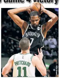  ??  ?? TOUGH TASK: Payton Pritchard tries to defend Kevin Durant, who finished with 42 points and five assists, during the Nets’ 141-126 win over the Celtics.