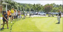  ??  ?? From left, Vic Samuels, Bernice Brezina, Dixie Miller, Helen Heier, Mary Duley Guy and Sheila Draper receive putting instructio­ns from Swan Point’s PGA Head Golf Pro Robbie Early, right, during the Sip & Swing sponsored by G.S. Proctor & Associates....