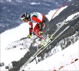  ?? ALESSANDRO TROVATI, THE ASSOCIATED PRESS ?? Canada’s Erik Guay is airborne on his way to winning the men’s super-G at the alpine ski world championsh­ips in St. Moritz, Switzerlan­d, on Wednesday. Fellow Canuck Manny Osborne-Paradis was third.