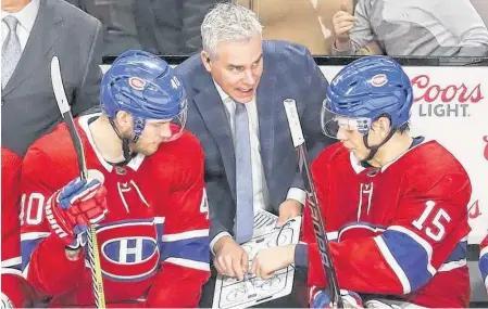  ?? JOHN MAHONEY • POSTMEDIA NEWS FILE ?? Montreal Canadiens assistant coach Dominique Ducharme talks strategy with Joel Armia, left, and Jesperi Kotkaniemi during a game against the Florida Panthers in Montreal in 2019.