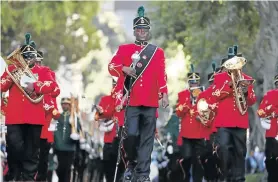  ?? Picture: POOL/AFP ?? POMP AND CEREMONY: A military band marches ahead of the annual state of the nation address at parliament in Cape Town