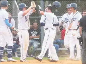  ?? STAFF PHOTO BY ANDY STATES ?? La Plata’s Peyton Gray is congratula­ted by teammates after hitting his first high school home run, a grand slam, in the bottom of the fourth inning in the Warriors’ game with the visiting Huntingtow­n Hurricanes on Thursday afternoon. La Plata won 11-1...