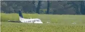  ?? NIKKI BOERTMAN/AP ?? A Beechcraft King Air rests in a soybean field after the pilot crash-landed Saturday near Ripley, Miss.