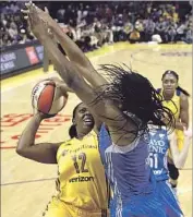  ?? Mark J. Terrill Associated Press ?? SPARKS GUARD Chelsea Gray tries to get a shot off against Lynx center Sylvia Fowles.
