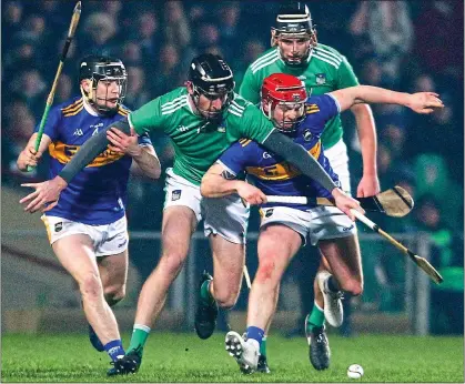  ??  ?? CHASE: Willie Connors of Tipperary (right) battles for possession with Limerick player Conor Boylan at the Gaelic Grounds