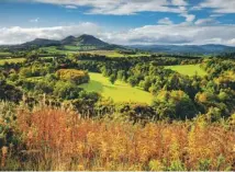  ??  ?? The sun rising over the Eildon Hills during autumn, main; the hills were once a lookout point for Iron Age people and Romans, above; authors Elspeth Turner and Donald Smith, left