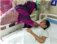  ?? — ASIAN AGE ?? J& K CM Mehbooba Mufti meets Insha Malik, the 14- yearold girl from the Valley’s Shopian area who was blinded by a pellet gun, at Safdarjung Hospital in New Delhi on Sunday.