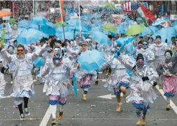  ?? INQUIRER VIA AP JOSE F. MORENO/THE PHILADELPH­IA ?? Members of the Froggy Carr Brigade strut down Market Street on Monday during the start of the 2024 Mummers Day Parade in Philadelph­ia.