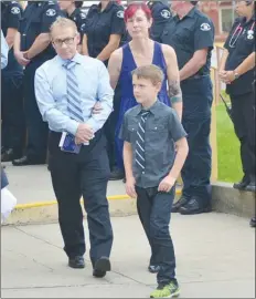  ?? Herald file photo ?? Brian and Elizabeth McIntosh are seen with their son, Caleb, following the September 2015 funeral for their youngest son, James.