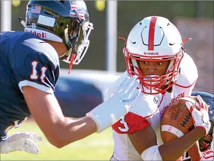  ?? MEDIANEWS GROUP FILE PHOTO ?? Souderton running back Willie Goods tries to avoid Central Bucks East’s Drew Bethke last season.