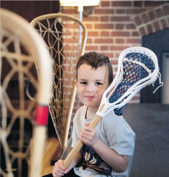  ?? — POSTMEDIA NEWS ?? Kahrhatake­hshon Delormier, 4, a seventh generation descendant of the famous lacrosse player Big John Canadian, was on hand for the Canadian Lacrosse Foundation news conference, which unveiled plans for the re-creation of a 1867 game on June 17.