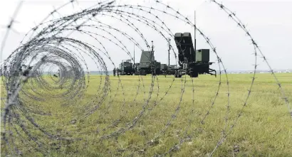  ?? Picture: AFP ?? SCHEDULED TEST. Soldiers from the Japan Air Self-Defence Force set up PAC-3 surface-to-air missile launch systems during a temporary deployment drill at US Yokota Air Base yesterday. About 50 Japanese servicemen took part in the drill.