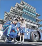  ?? DARRON CUMMINGS/AP ?? Scott Dixon, of New Zealand, celebrates with his wife, Emma, and children, Poppy and Tilly, after winning the Indianapol­is 500 pole for the third time in his career.