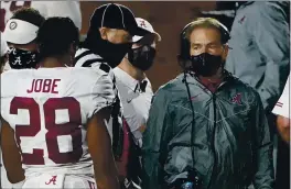  ?? ROGELIO V. SOLIS — THE ASSOCIATED PRESS ?? AlABAmA coAch Nick Saban, right, has tested positive for COVID-19 but has no symptoms.