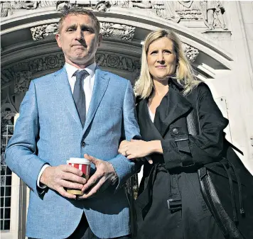  ??  ?? Jon Platt with his wife, Sally, at the Supreme Court yesterday. He apologised to her for his ‘stubbornne­ss’ in pursuing the case