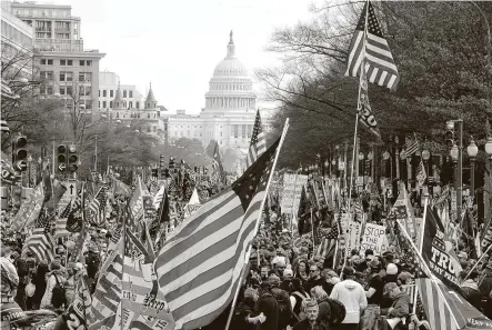  ?? Luis M. Alvarez / Associated Press ?? With Michael Flynn, the recently pardoned former national security adviser, speaking on stage Saturday, President Donald Trump flew over a crowd of supporters and Proud Boy members on his way to the Army-Navy football game.