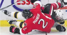  ?? THE CANADIAN PRESS ?? Bruins winger Brad Marchand and Senators defenceman Dion Phaneuf get tangled up during Boston’s Game 1 win.