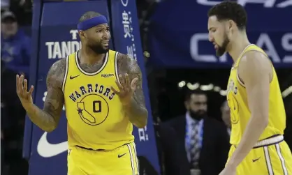  ??  ?? DeMarcus Cousins, left, reacts to an official’s call as Klay Thompson walks by. Photograph: Jeff Chiu/AP