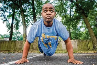  ?? JOSE F. MORENO / THE PHILADELPH­IA INQUIRER ?? Tashime Felder does pushups near his home in Cherry Hill, New Jersey. After being told he was too overweight for the Army, Felder began a stunning weight-loss journey. Last month, he returned to the recruiting center to enlist – 110 pounds lighter with just 17% body fat.