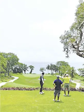  ??  ?? THE par-3, No. 11, measuring 157 yards from the championsh­ip tee, remains one of the signature holes of the redesigned course. Facing the sea, the wind becomes a big factor in selecting the right club to use.