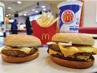  ?? AP FILES ?? AMcDonald’s Quarter Pounder with Cheese ( left) and a Double Quarter Pounder with Cheese.