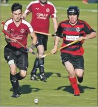  ?? Photograph: Stephen Lawson. ?? Lochside’s Craig MacDougall and Kilmory’s Iain Robertson in a race for the ball during the South Division One match on Wednesday August 9. Lochside were convincing 6- 0 winners.