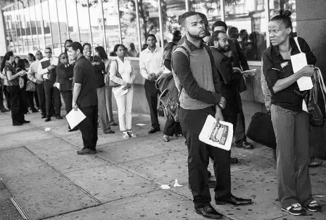  ?? Andrew Burton / Gett y Images ?? A lineup at a jobs fair in September in the Bronx. U.S. non-farm payrolls rose by 248,000 last month and the country’s jobless rate fell to 5.9%. The results showed a stronger labour market than analysts had anticipate­d.