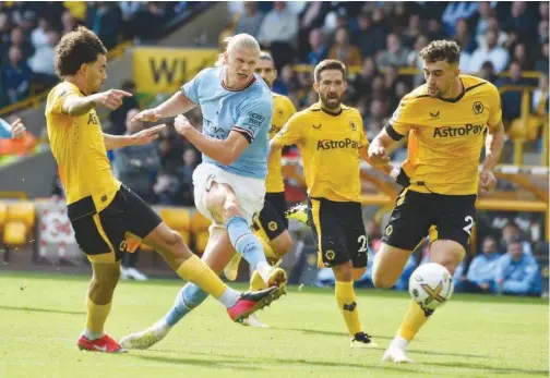  ?? Associated Press ?? ±
Manchester City’s Erling Haaland shoots to score a goal against Wolverhamp­ton Wanderers during their match on Saturday.