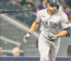  ?? AP ?? TOSSED ASIDE: Giancarlo Stanton tosses his bat after smashing a 437-foot solo homer in the ninth inning.