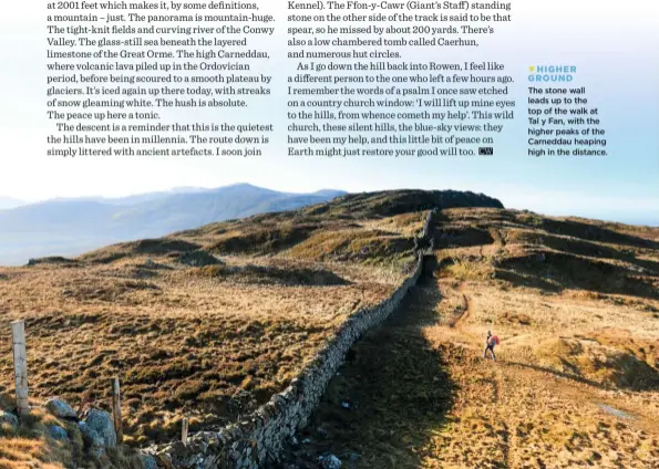  ??  ?? The stone wall leads up to the top of the walk at Tal y Fan, with the higher peaks of the Carneddau heaping high in the distance. HIGHER GROUND